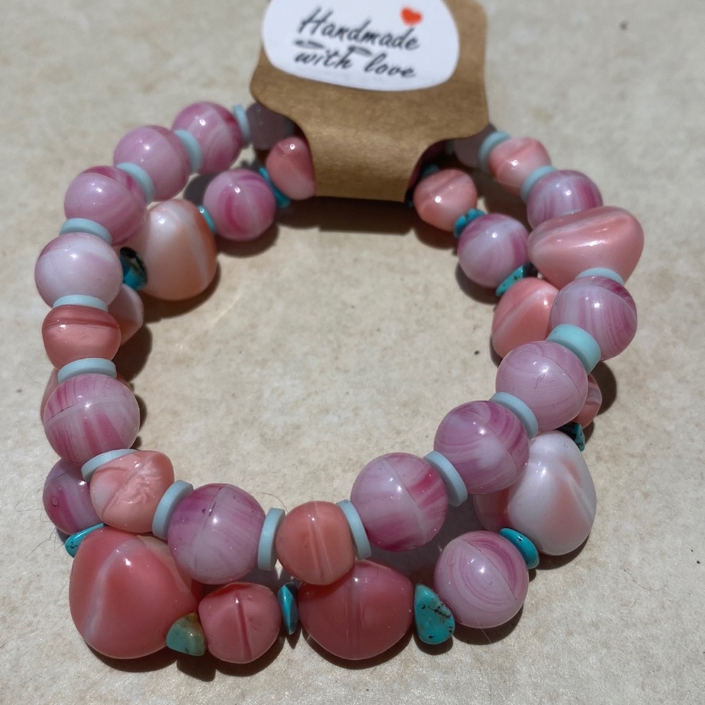 NWT bundle of two bracelets, pink and teal,hand made 6 1/2 in w/ stretchiness